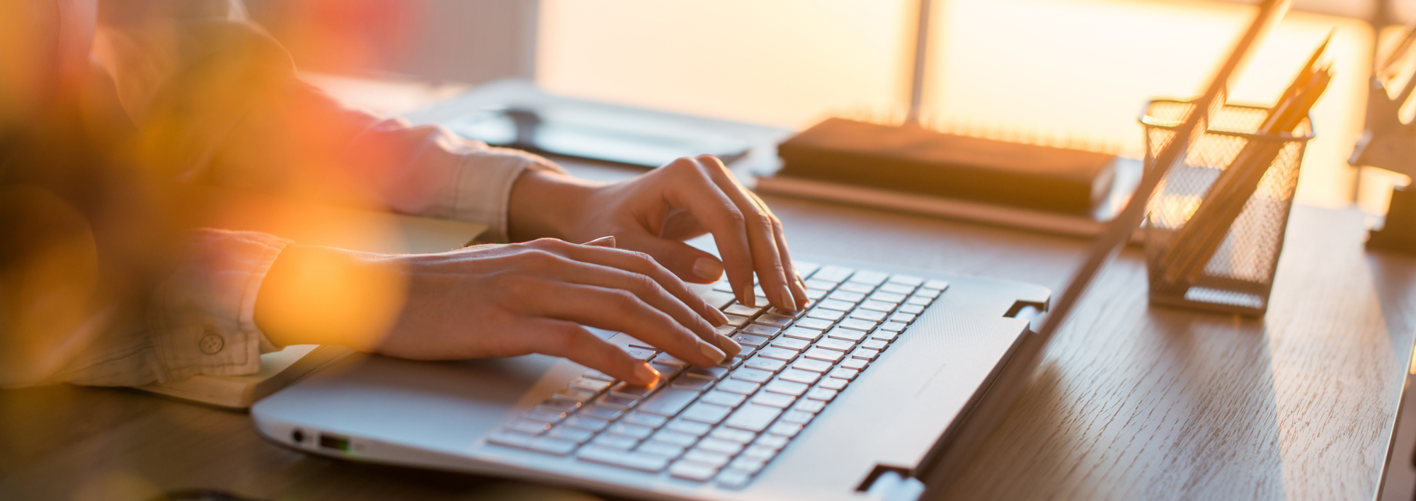 person typing on a laptop